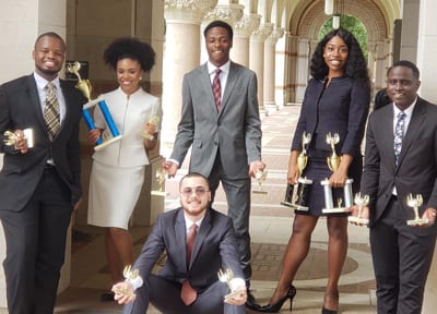 From left are Maliq Wright, Rahmane Dixon, Dimitri Brooks, Emmanuela Wade, Jaylen Bolden, and Louis Mendez, kneeling.
