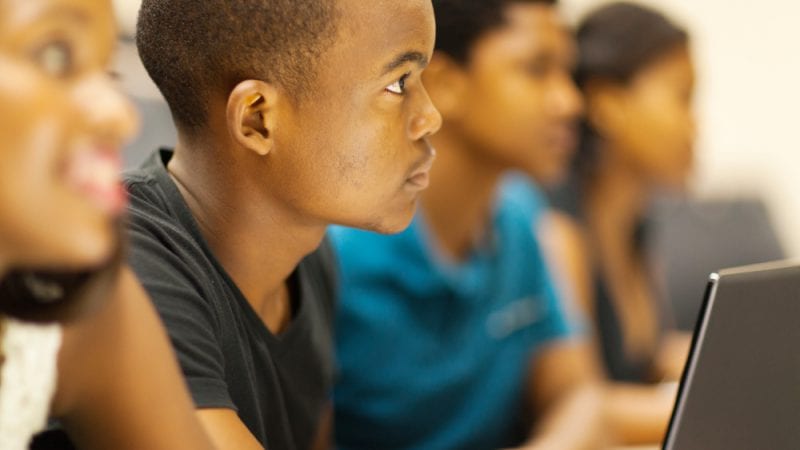 Students in a classroom listening to a lecture