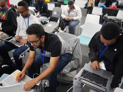 Group shot of students working on laptops